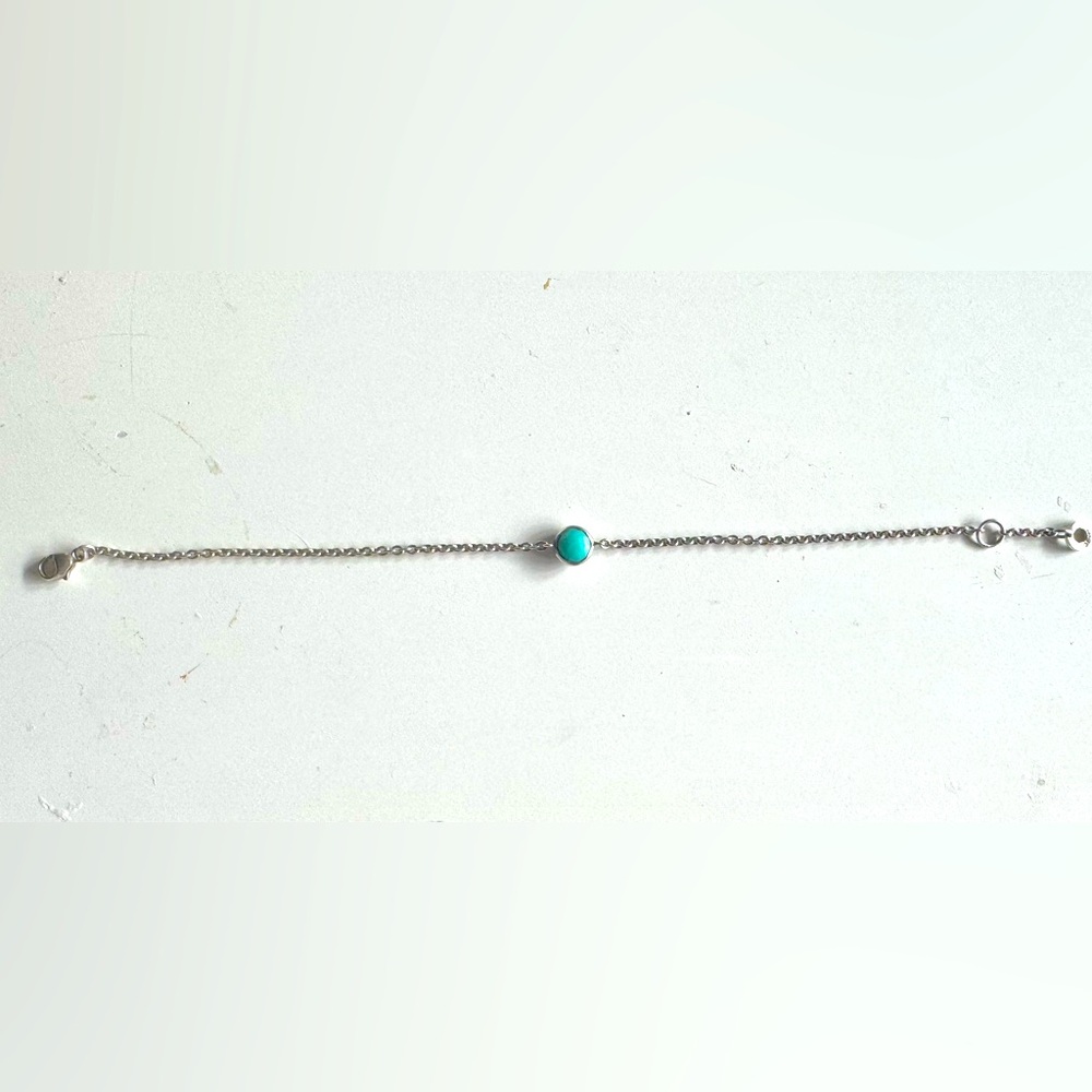 Ippolita 6.5 inch-7 inch silver  bracelet with a turquoise stone in the center